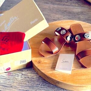 Christian Louboutin Bitcorn Sandals with silver medallion accents